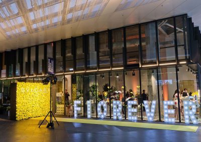 Yellow carpet, light display and flower wall at the Bulgari Fiorever Launch