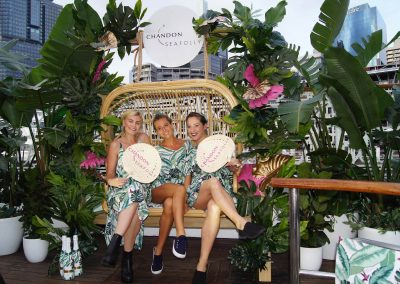 3 female models sitting rotan lounge Chandon x Seafolly PR launch event