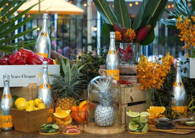 Champagne bottles display with fruit Clicquot Beach House