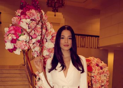 Model holding flower arrangement Crown Resorts Sydney Ladies Luncheon