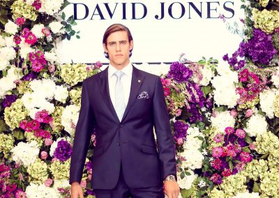 Model posing flowers background Crown Resorts Sydney Ladies Luncheon