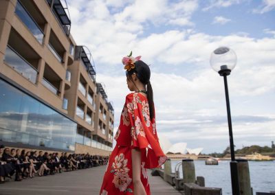 Model in red floral dress at Do Manh Cuong Back to Nature Fashion Parade