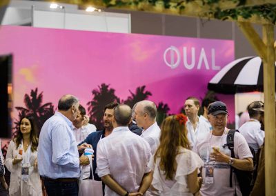 Guests talking Dual Australia Exhibition Stand - Miami Poolside