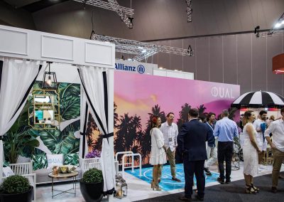 Guests talking Dual Australia Exhibition Stand - Miami Poolside