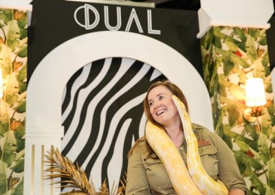 Entertainer holding snake Dual Australia Exhibition Stand Safari Glam