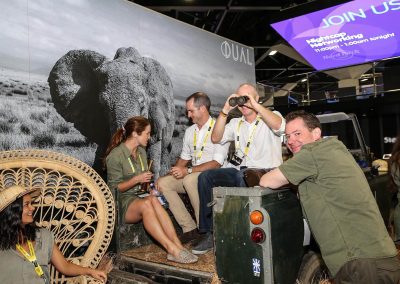 Guests sitting in vintage car Dual Australia Exhibition Stand Safari Glam