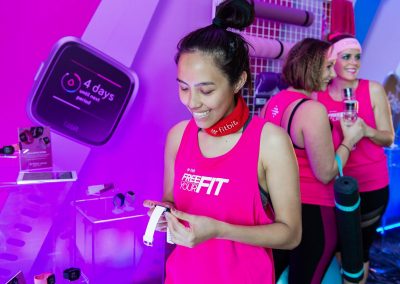 A guest checking her fitness statistics on her FitBit