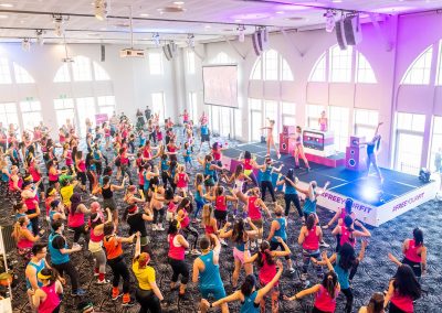 An aerobics class for 150 attendees at the Free Your Fit FitBit event