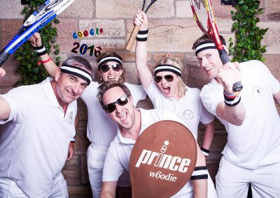 Group of people posing in tennis outfits Google Summer Party event