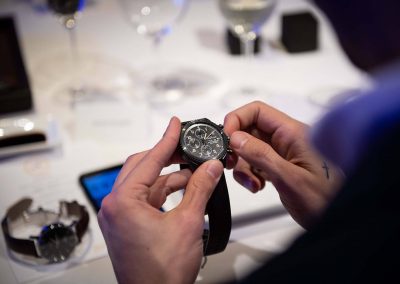 Close up of hands holding watch at Gregory Jewellers & Breitling VIP client dinner