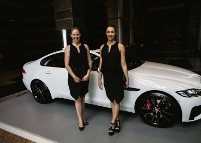 2 models next to car Jaguar XF Australian Launch