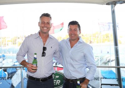 2 men smiling holding beers Land Rover All-New Discovery Launch event