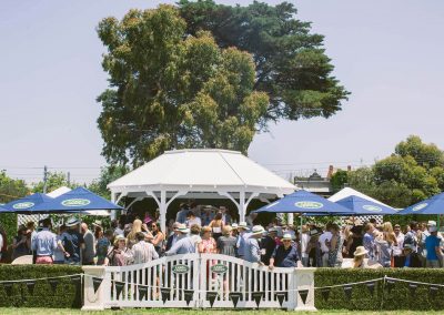 Guests talkiing outside Land Rover Polo Club for Polo in the City English Polo Garden