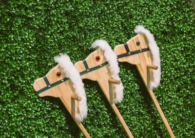 3 wooden horses props green wall Land Rover Polo Club for Polo in the City English Polo Garden