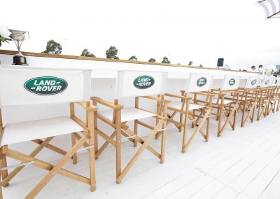 Group of chairs lined up Land Rover Polo Club for Polo in the City Hamptons Polo Club