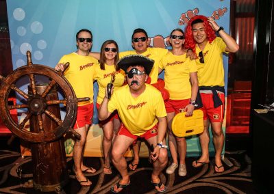 Guests baywatch outfits posing Mirvac Christmas Party Ahoy Sailor Nautical