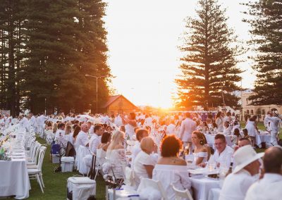 Guests sitting at tables outdoors Moet Dinner en Blanc National Sponsorship Activation