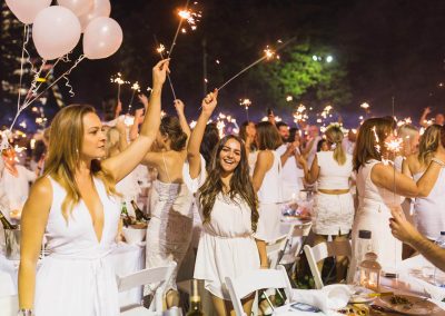 Guests celebrating Moet Dinner en Blanc National Sponsorship Activation