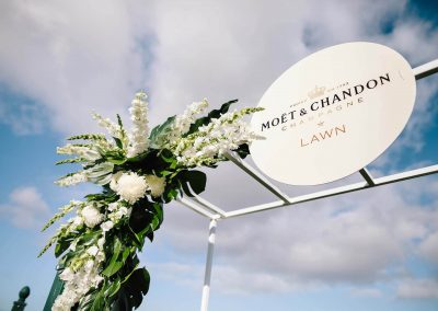 Floral display and metal sign Floral display wooden horses Moet et Chandon Lawn at Melbourne Racing Club
