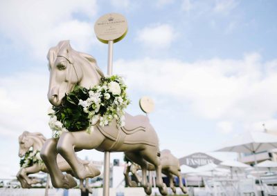 Floral display wooden horses Moet et Chandon Lawn at Melbourne Racing Club