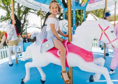 Young girl riding the Network 10 Carousel