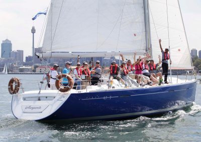 Guests on sailing yacht waving Schlumberger Annual International Conference