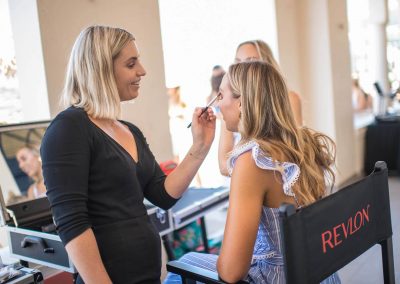 Makeup artist giving guest a sun bronzed makeup look
