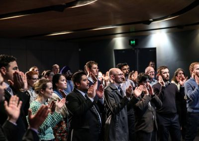 Audience applauding Australian Energy Market Commission Annual Staff Day